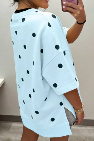Light blue polka dot oversized t-shirt with short sleeves and side slits.