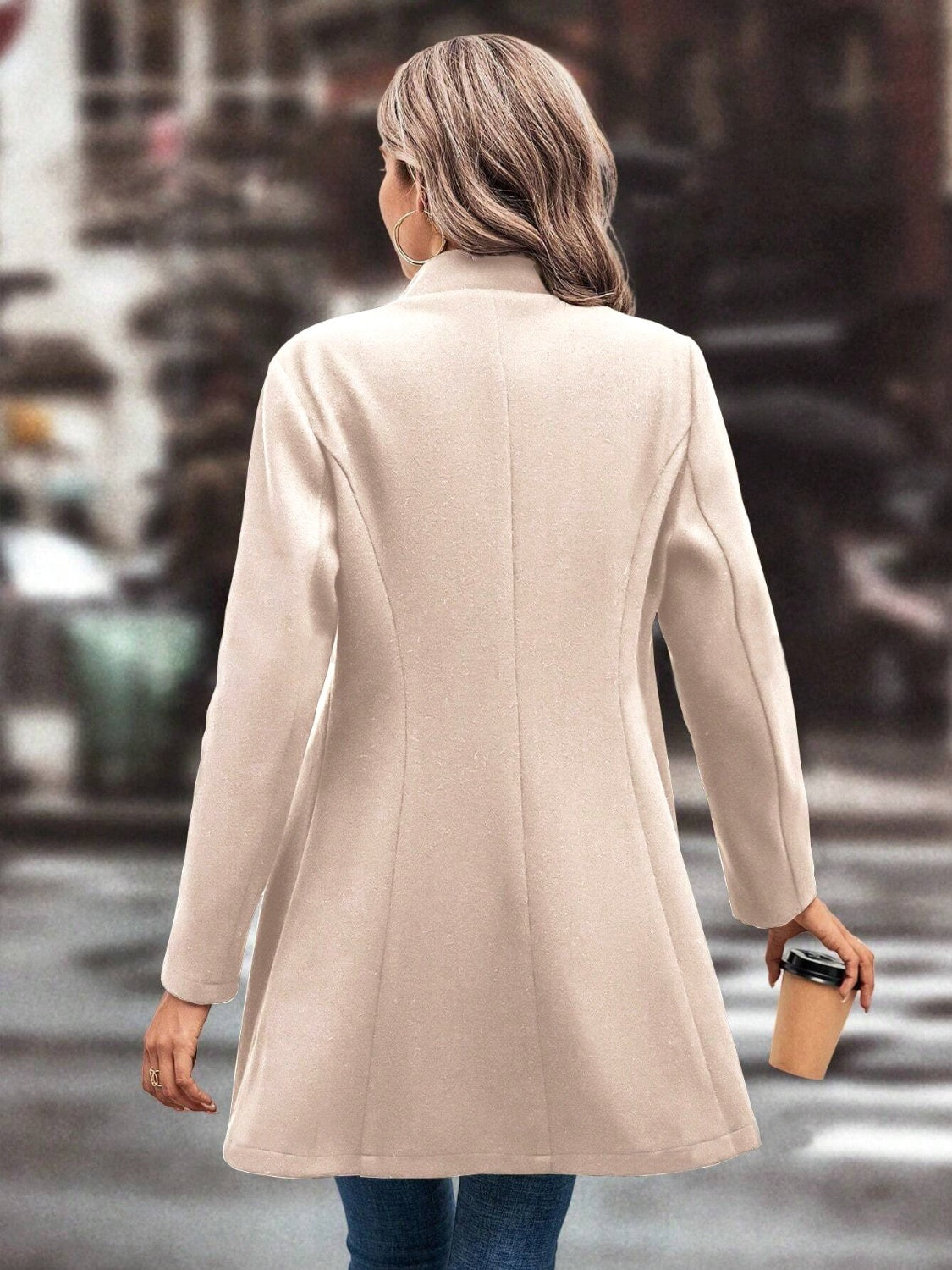 Sculpted flare-hemmed overcoat in Dust Storm wool blend, shown from the back.