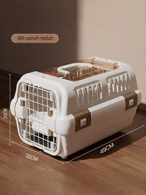 White gray hard-sided pet carrier with skylight and gold accents.