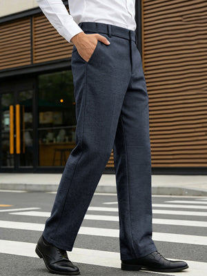 Classic fit navy dress pants with pockets, straight leg, shown on a man walking.