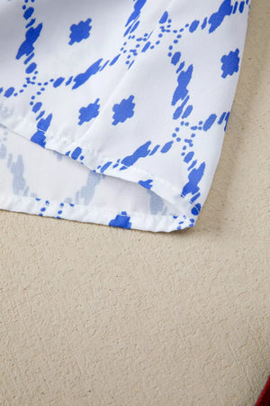 Patchwork babydoll maternity overshirt in white with blue abstract pattern and puff sleeves.