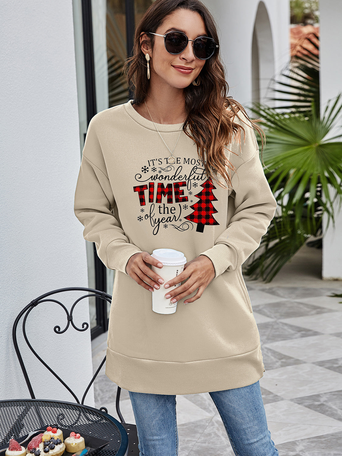 Beige tunic sweatshirt with "It's the most wonderful time of the year" holiday graphic and buffalo plaid Christmas tree.