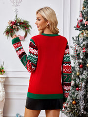 Red acrylic knit sweater with festive fair isle sleeves and green trim.