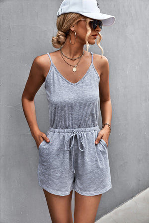 Gray V-neck drawstring romper with adjustable straps and pockets.