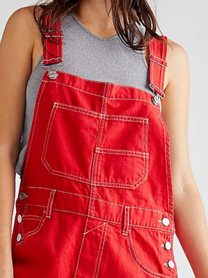Crimson denim short overalls with contrast stitching and button side details.