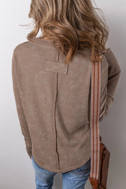 Taupe waffle knit blouse with notch neckline and button detail on back yoke.