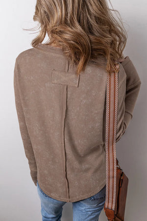 Taupe waffle knit blouse with notch neckline and button detail on back yoke.