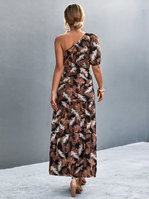 Tropical print one-shoulder maxi dress in black with a tiered skirt and puff sleeve.