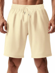 Apricot chino shorts with drawstring waist and elastic waistband.