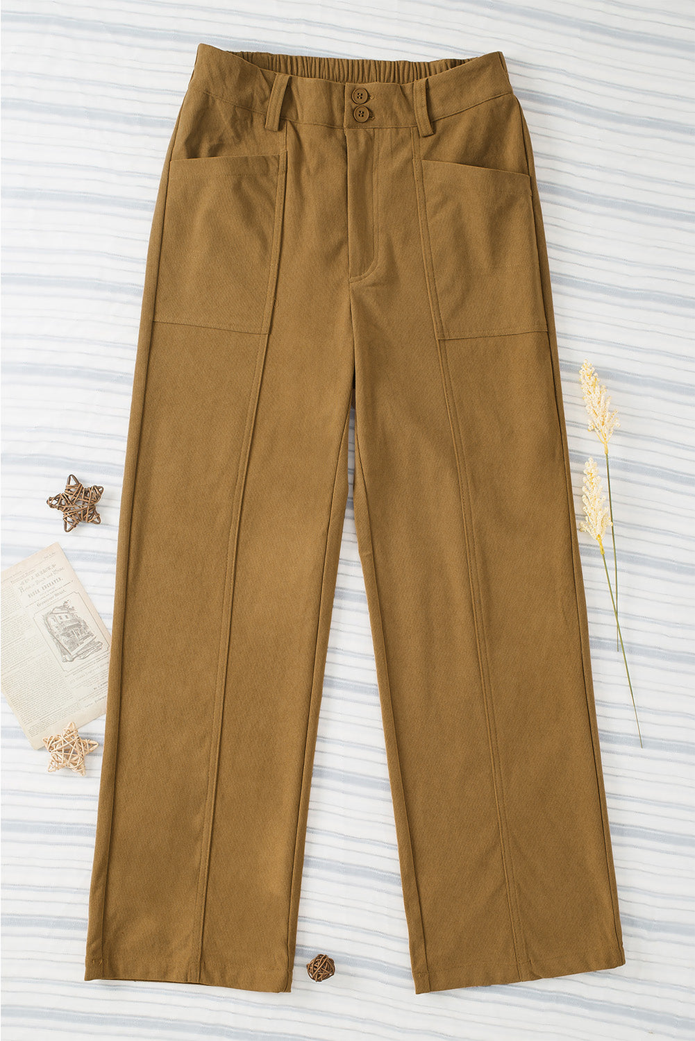 Caramel seamed front wide leg trousers with buttoned waist and patch pockets.