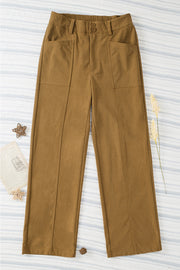 Caramel seamed front wide leg trousers with buttoned waist and patch pockets.