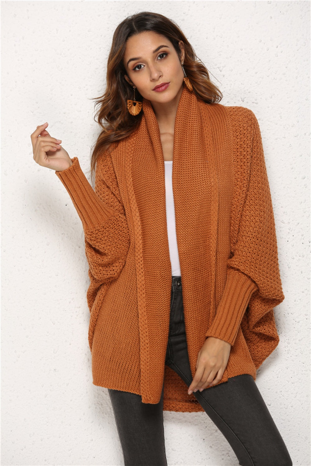 Textured cocoon knit cardigan in caramel with batwing sleeves and a shawl collar.