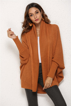 Textured cocoon knit cardigan in caramel with batwing sleeves and a shawl collar.