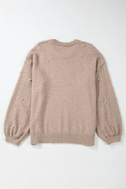 Dust Storm knit sweater with pearl embellished balloon sleeves and crew neck.
