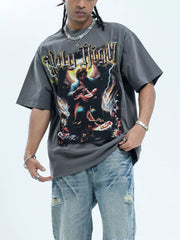 Grey cotton oversized t-shirt with Holy Night graphic print and distressed denim shorts.