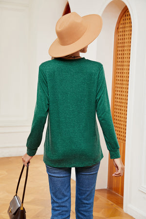 Dark green long sleeve Henley-inspired top with crew neck and button detail