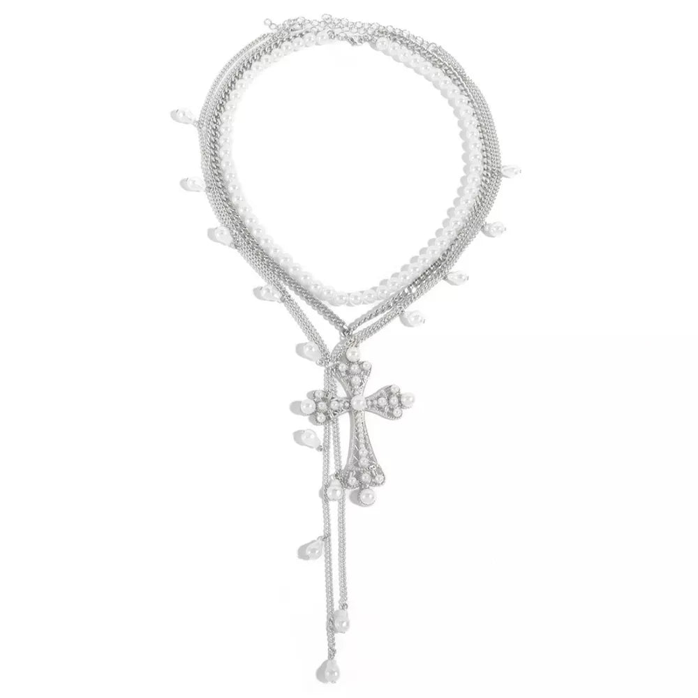 Silver layered necklace with pearl accents and a crystal cross pendant.