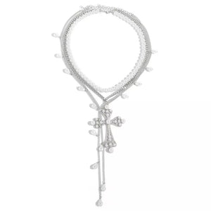 Silver layered necklace with pearl accents and a crystal cross pendant.