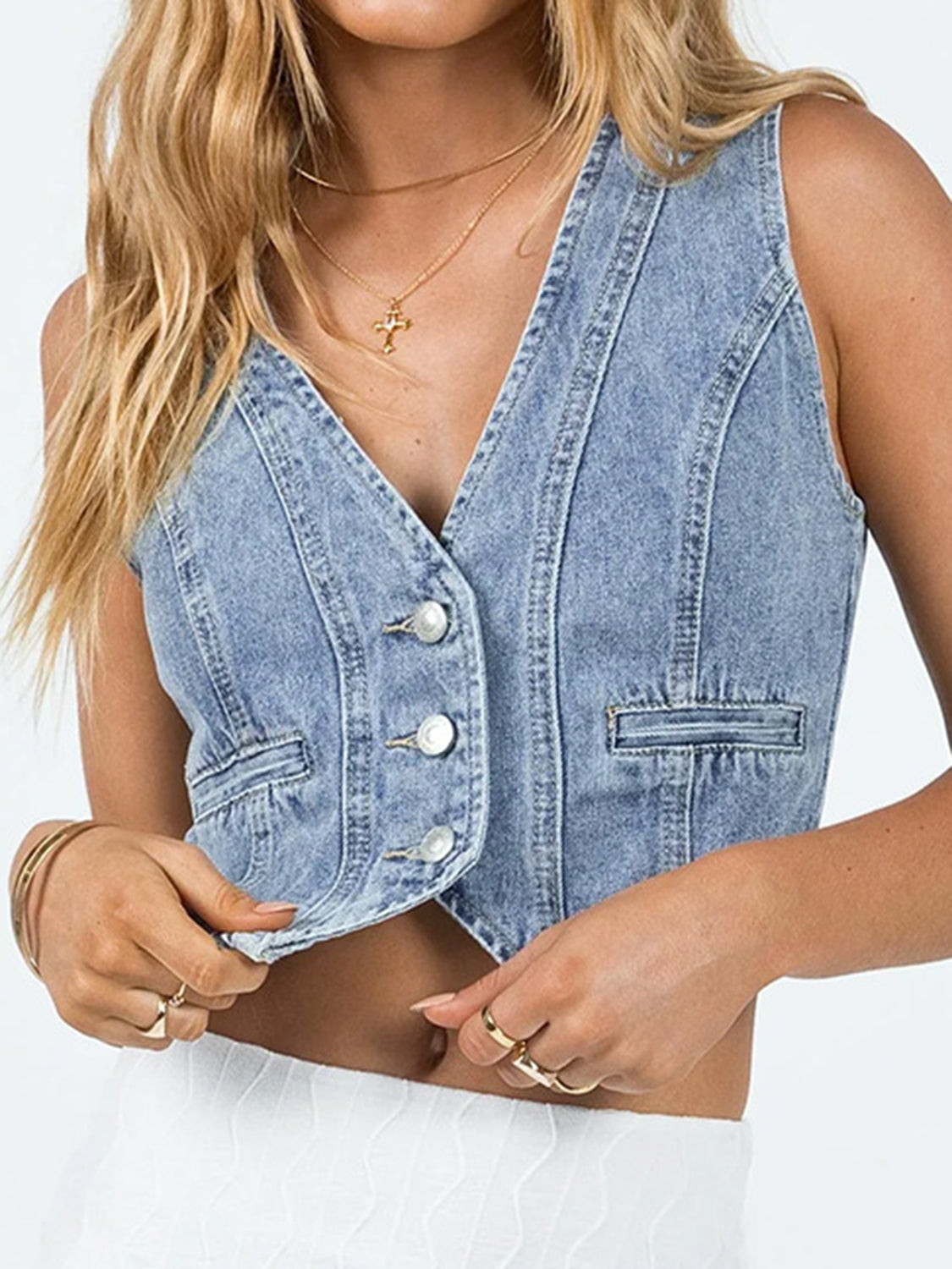 Light blue denim vest with V-neck, button front, and chest pocket.