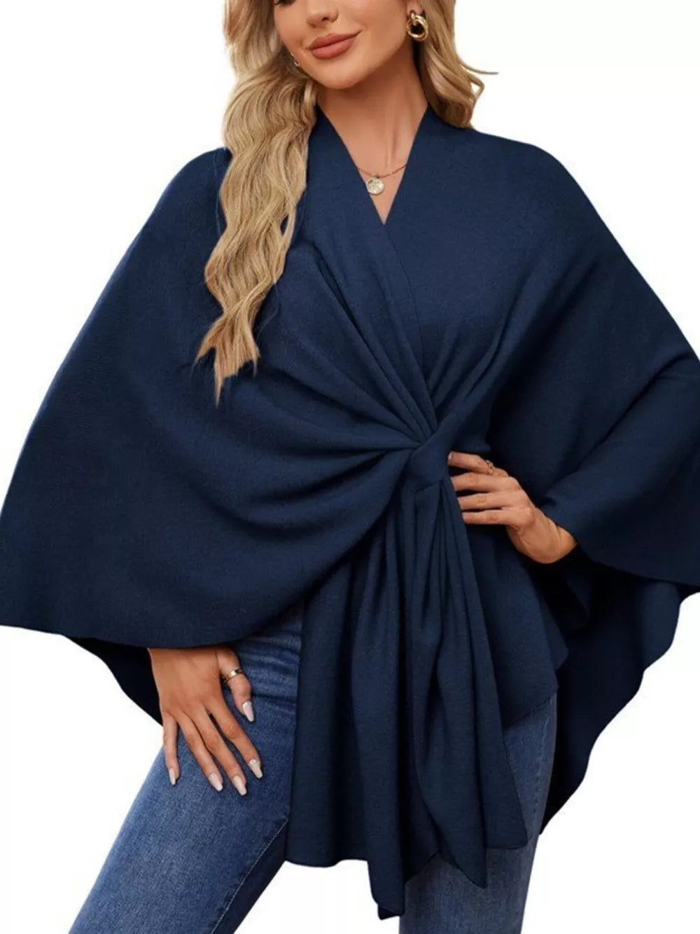Navy tie-front knit cape top with draped elegance and V-neck.