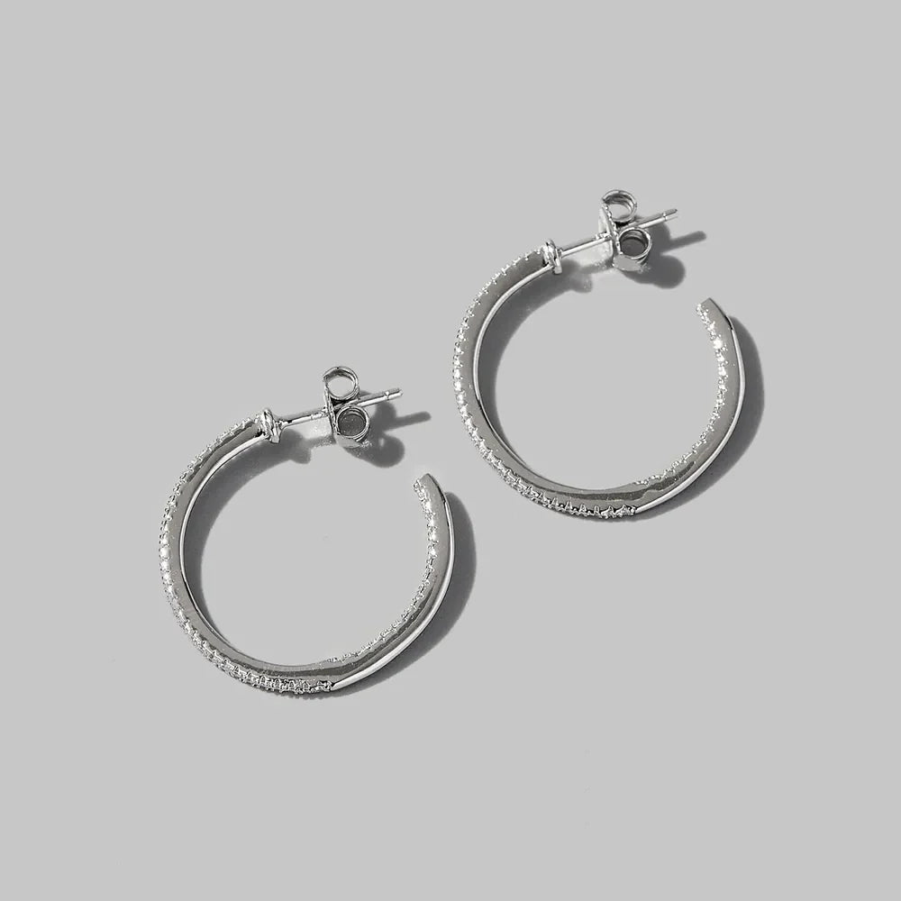 Silver pavé zirconia half-hoop earrings in 925 sterling silver.