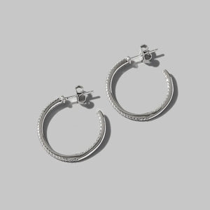 Silver pavé zirconia half-hoop earrings in 925 sterling silver.