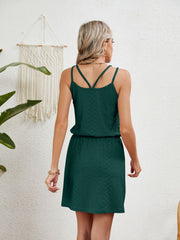 Dark green geometric eyelet crossover strap mini dress with elastic waist