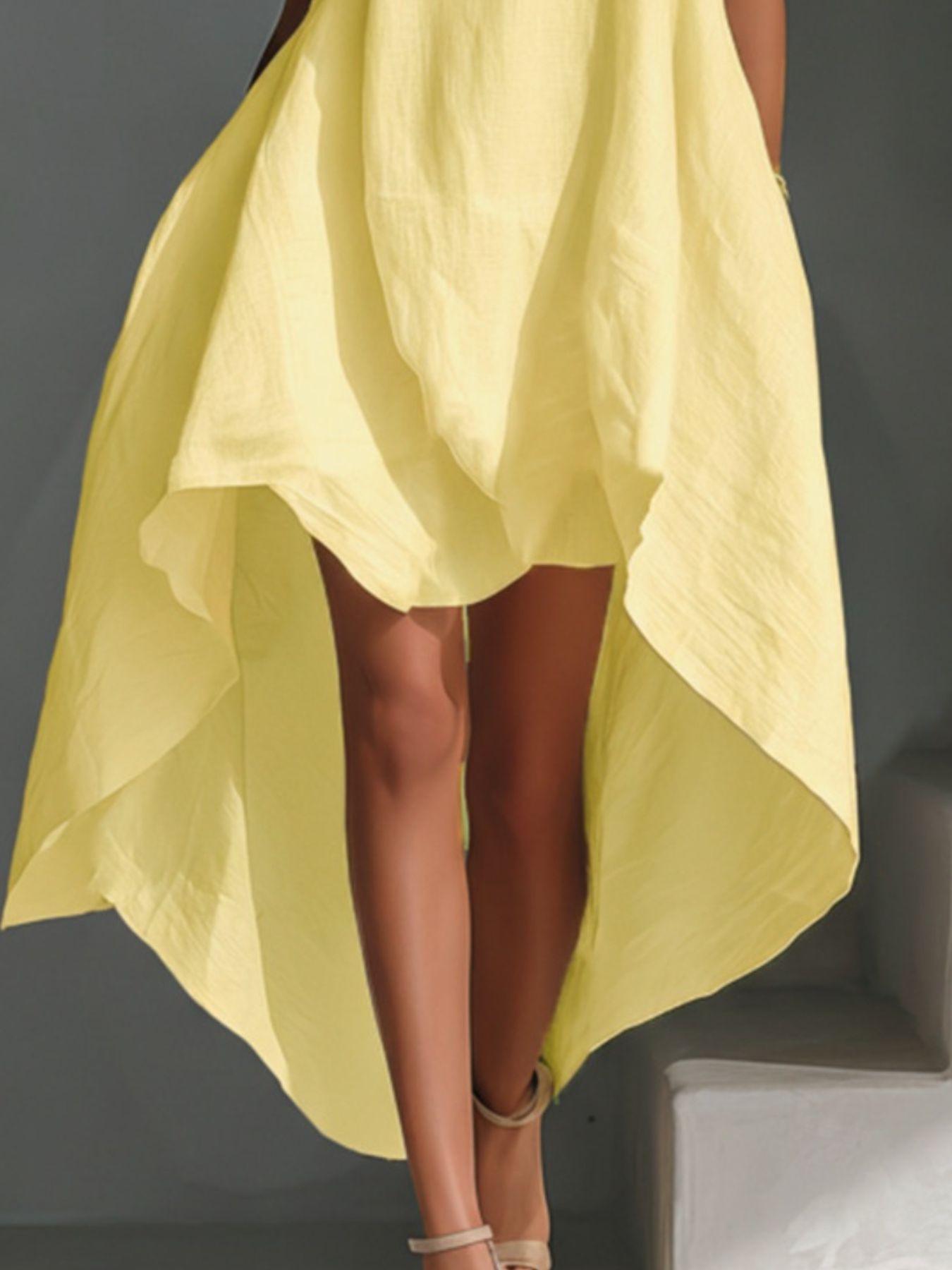 Yellow high-low hem dress with asymmetrical flowy skirt detail