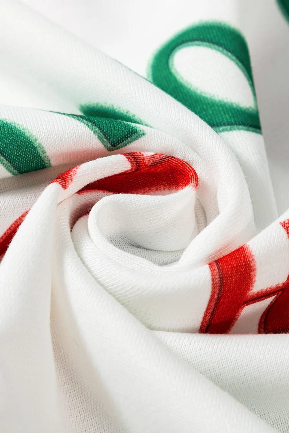 White loungewear set with red and green festive "Ho Ho Ho" lettering detail