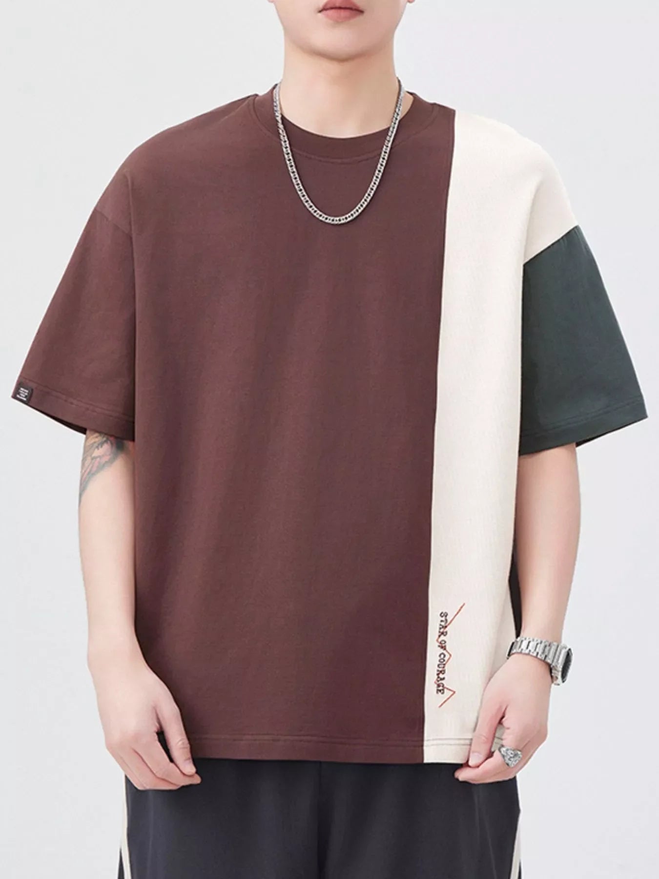 Oversized cotton t-shirt with color block design in coffee brown, cream, and dark gray.