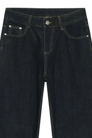Dark denim exaggerated wide leg trousers with visible stitching and button fly.