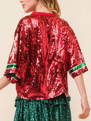 Sequin Christmas tree tee in burgundy with green and white striped trim on sleeves.