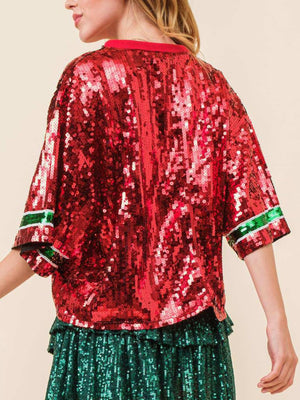 Sequin Christmas tree tee in burgundy with green and white striped trim on sleeves.