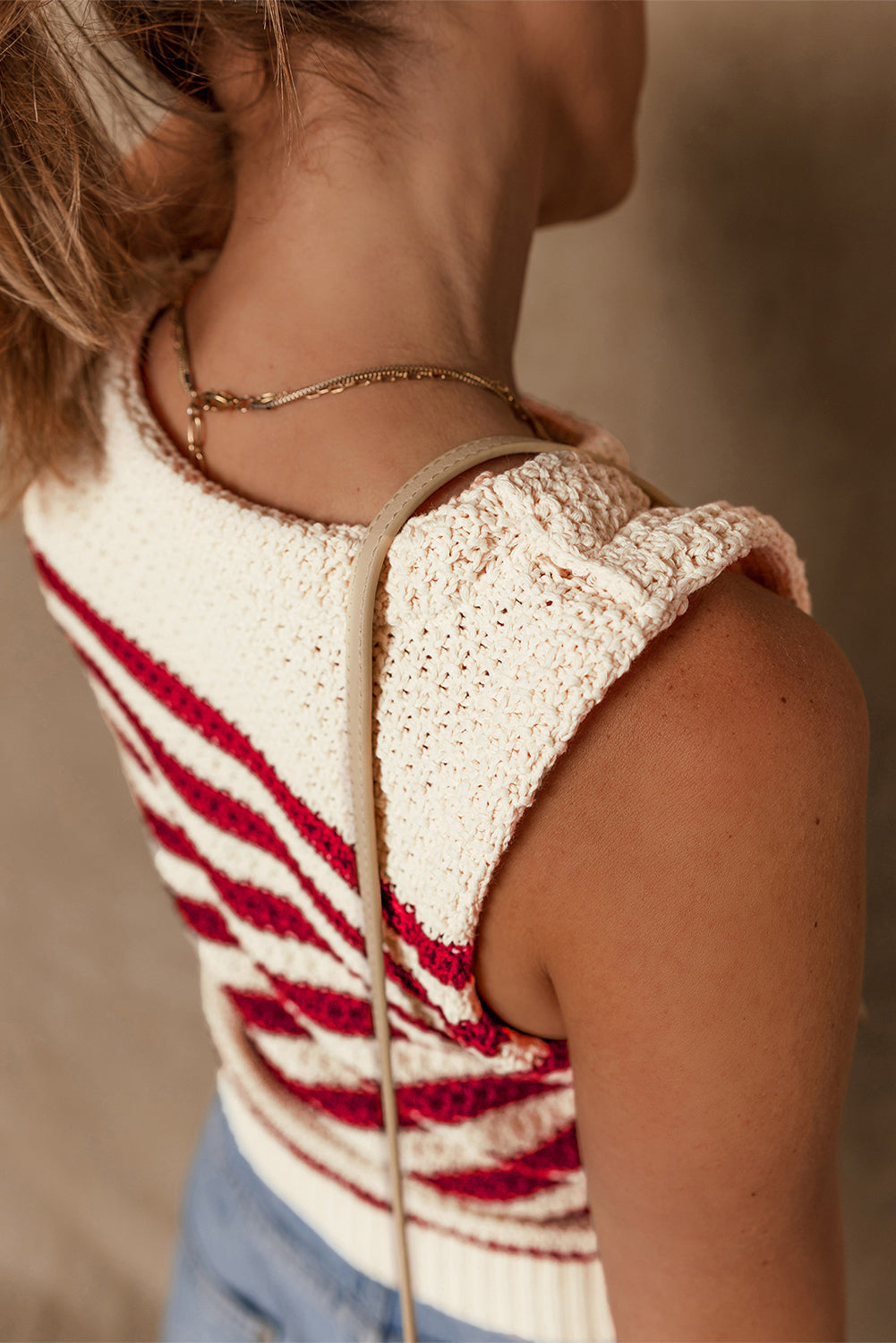 Textured stripe knit tank top with red stripes and a relaxed fit.