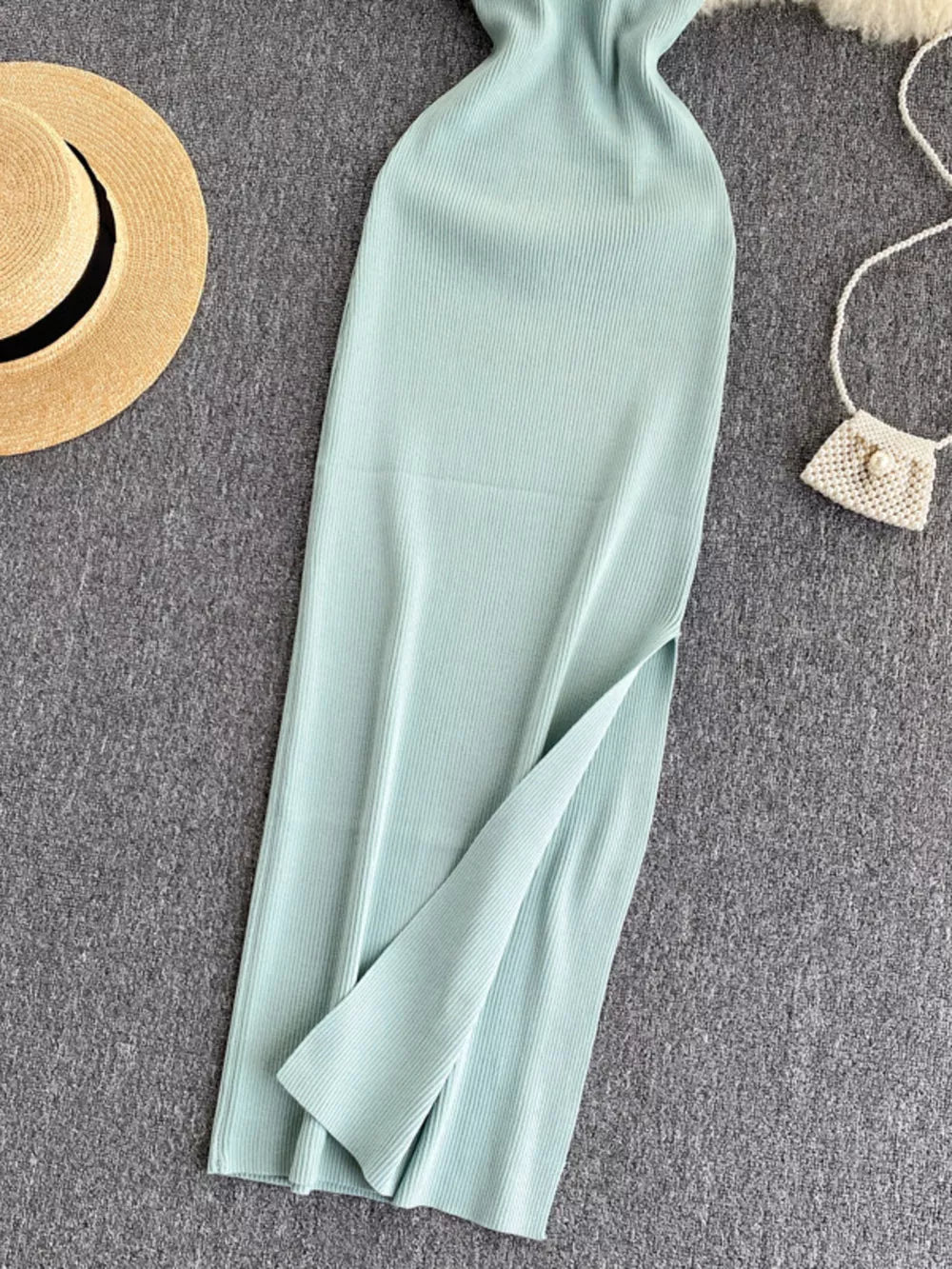 Light blue ribbed knit midi dress with a high slit and cutout back detail.
