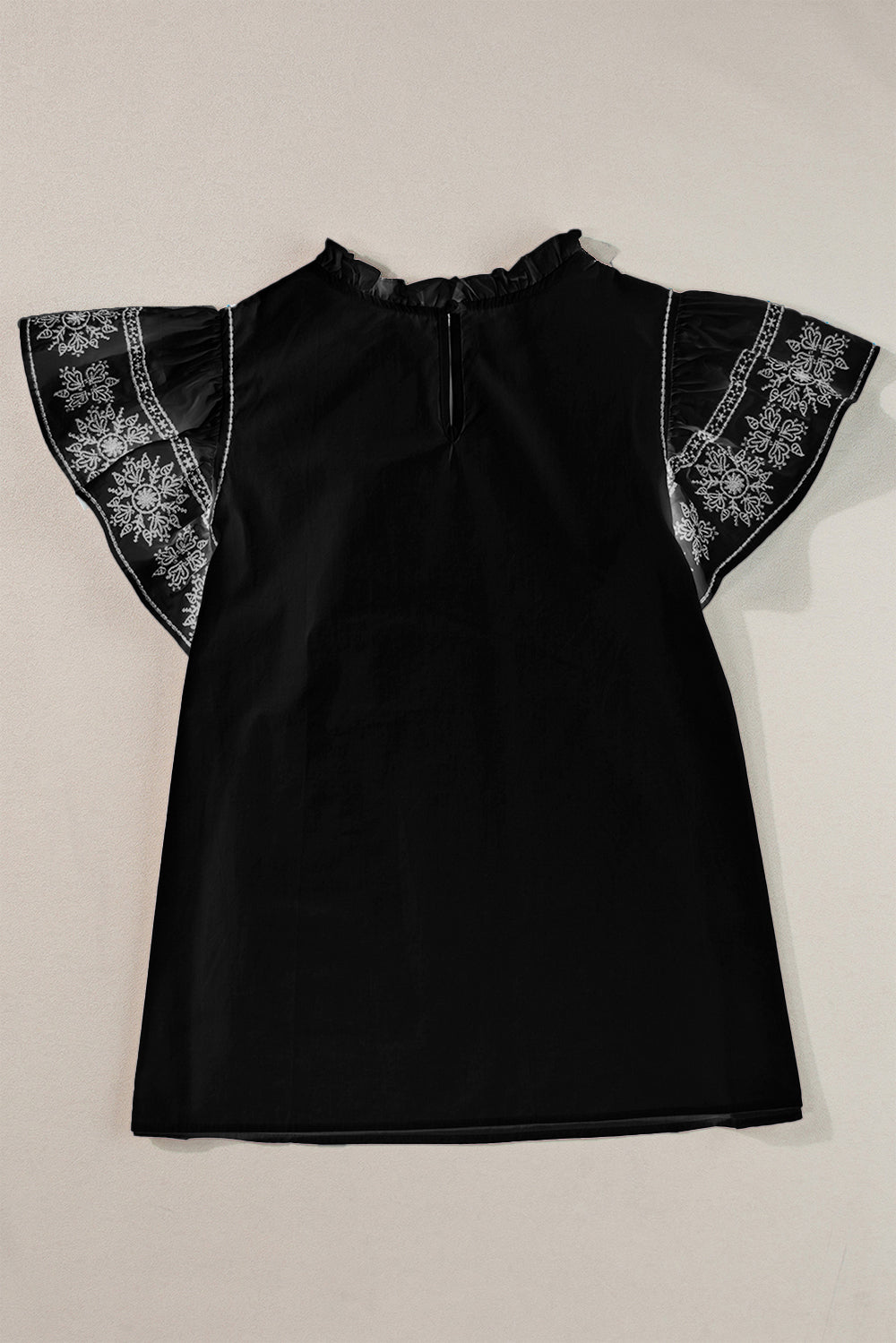 Black embroidered sleeve ruffle neck blouse