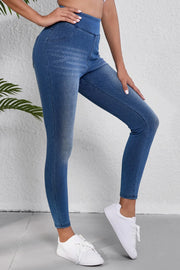 Denim-effect leggings in medium blue with a sculpted high rise and faux pocket details.