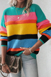 Rainbow stripe knit crewneck sweater with diamond pattern detail in turquoise and pastel blue.