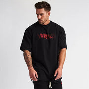 Black oversized t-shirt with red gradient Vanquish graphic print.