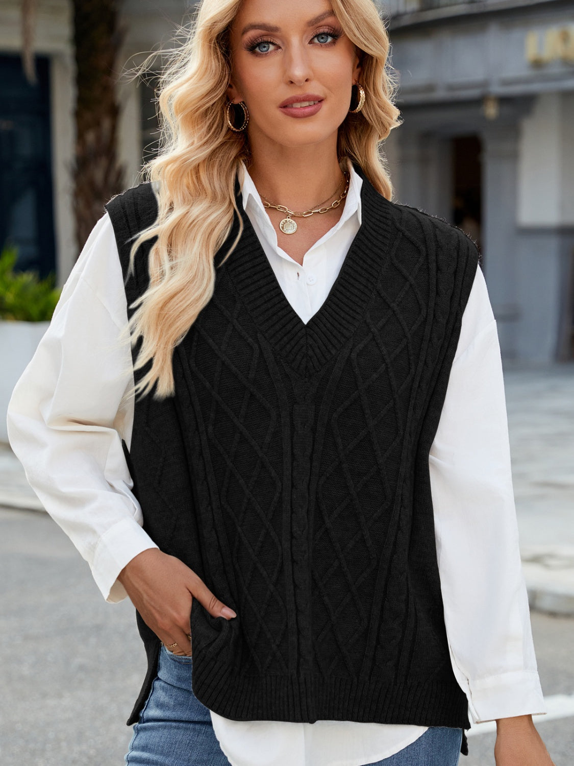 Black cable knit v-neck sweater vest with diamond pattern, acrylic.