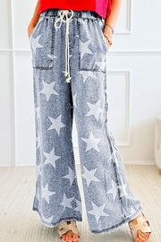 Cosmic Wash Star Print Palazzo Jeans in medium, featuring a drawstring waist and wide leg cut.
