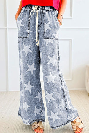 Cosmic Wash Star Print Palazzo Jeans in medium, featuring a drawstring waist and wide leg cut.