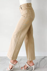 High-waisted cropped wide-leg jeans in tan denim with a cuffed hem.