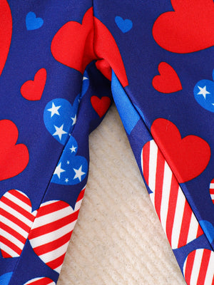 Patriotic baby outfit with red, white, and blue hearts and stripes pattern.