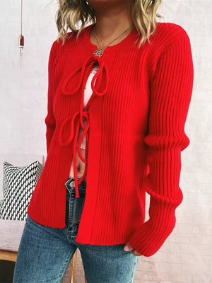 Red ribbed tie-front cardigan with cuffed sleeves and a crew neckline.