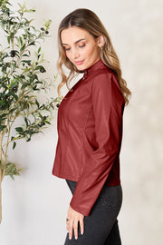 Biker-inspired faux leather jacket in Red Orange with a stand-up collar and zip closure.