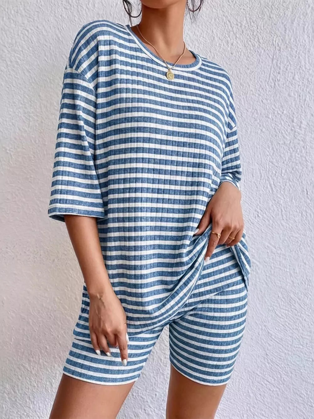 Blue striped two-piece set with elbow sleeve top and biker shorts.