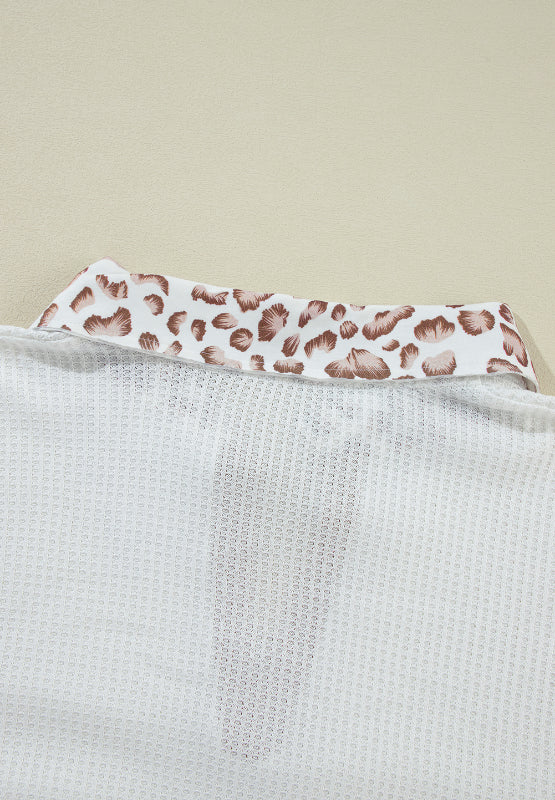 White waffle knit polo with leopard print collar detail