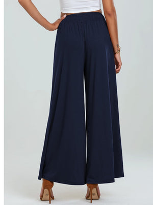 Navy elastic waist palazzo trousers with wide legs and pockets.
