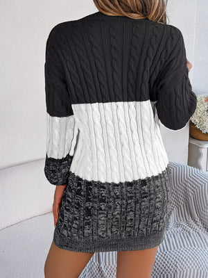 Textured cable knit sweater dress with colorblock black, white, and grey acrylic.
